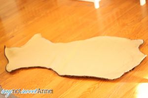 Easy DIY Faux Animal Skin Rug. Create an awesome accent rug with just a couple of fabric yards and some ingenuity!  | Saynotsweetanne.com